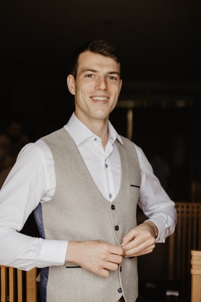 Groom gets ready suit waistcoat