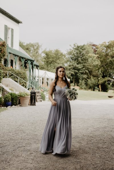 Bridesmaid walks toward ceremony