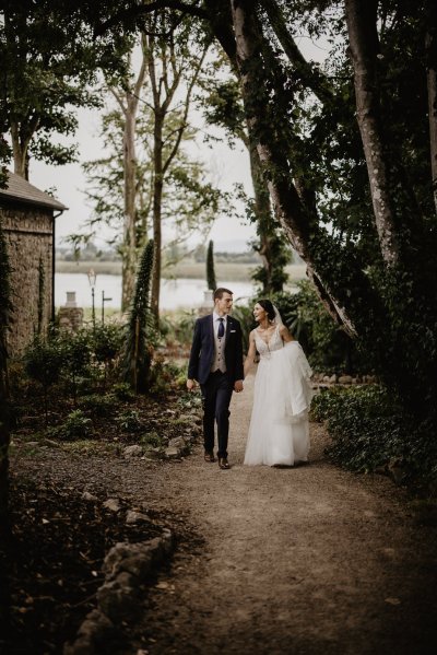 Couple walking in park pathway