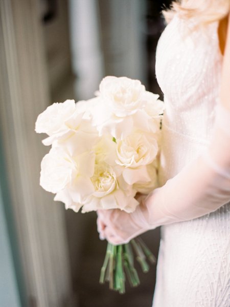 Bride holding bouquet of white flowers