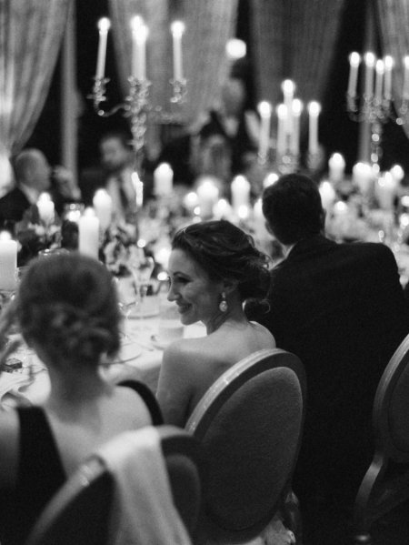 Black and White image of candles lighting dining room