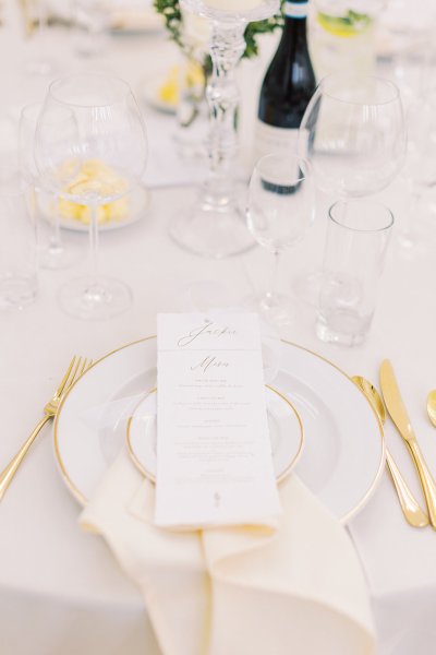 Gold cutlery plates on table interior dining room