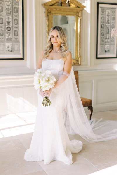 Bride holding bouquet of flowers veil