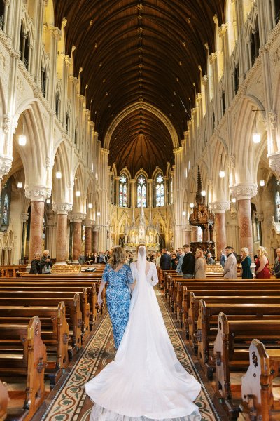 Mother and bride walking down the aisle