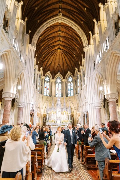 Bride and groom exit church/cathedral end of wedding ceremony