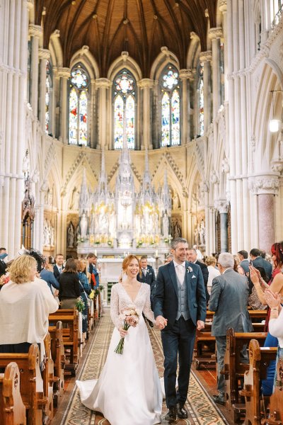 Bride and groom exit church/cathedral end of wedding ceremony