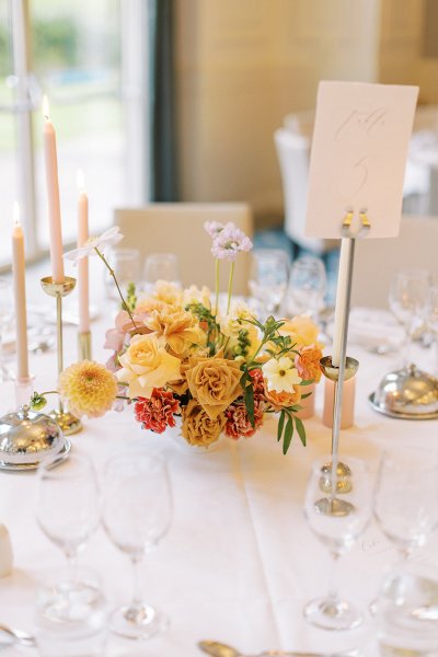 Dining room table candles flowers cutlery roses