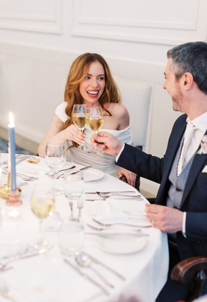 Bride and groom cheers prosecco champagne