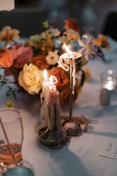 Candles lit lighting roses flowers colourful on table