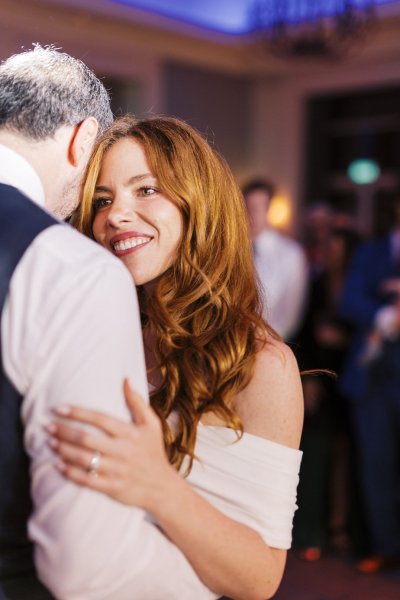 Bride and groom dance dancefloor smiling smile