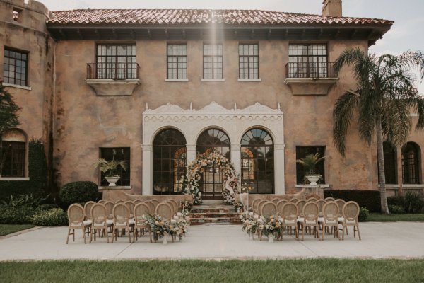 outdoor ceremony Exterior manor building wedding venue