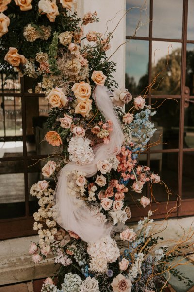 Bed of flowers and roses beside entrance