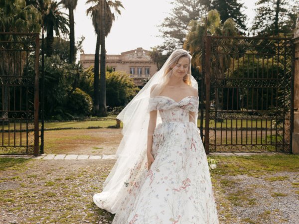 Monique Lhuillier Bridal bride exterior shot long veil floral design off the shoulder