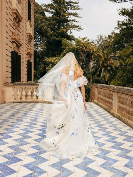 Monique Lhuillier Bridal train floral design from behind blue