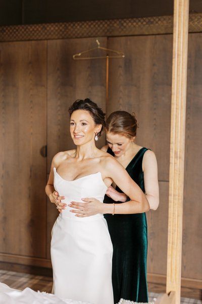 Mother of the bride wearing dark green dress