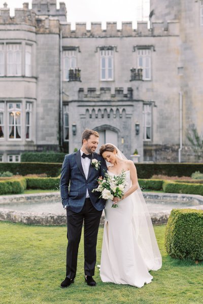 Bride and groom exterior Dromoland Castle in garden