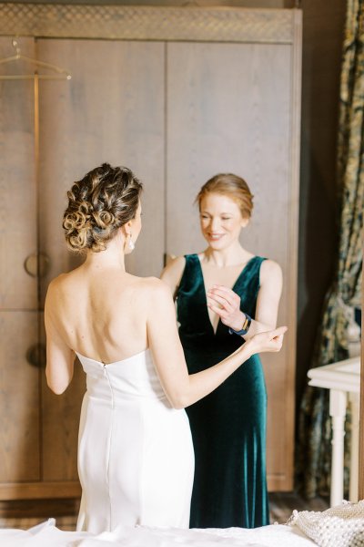 Mother of the bride wearing dark green dress