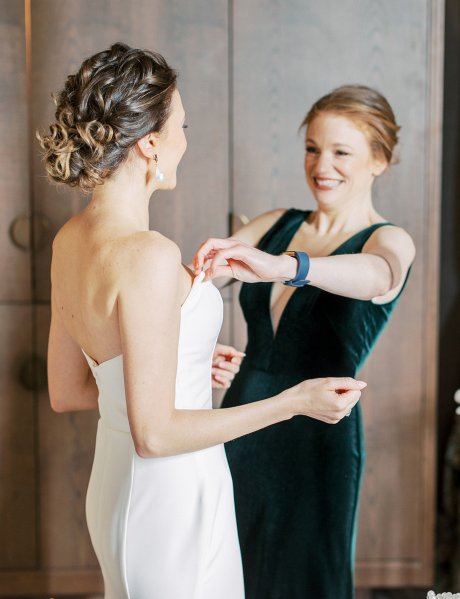 Mother of the bride wearing dark green dress