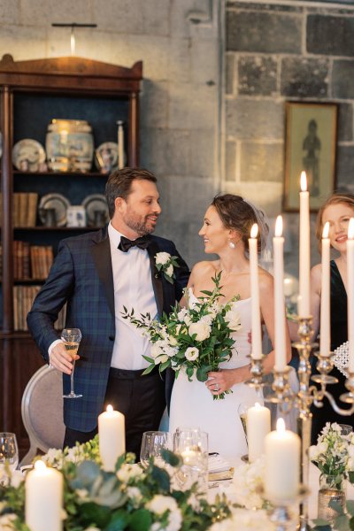 Bride and groom dining room candles lighting