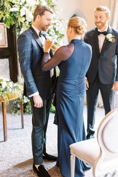 Mother fixing sons grooms tie