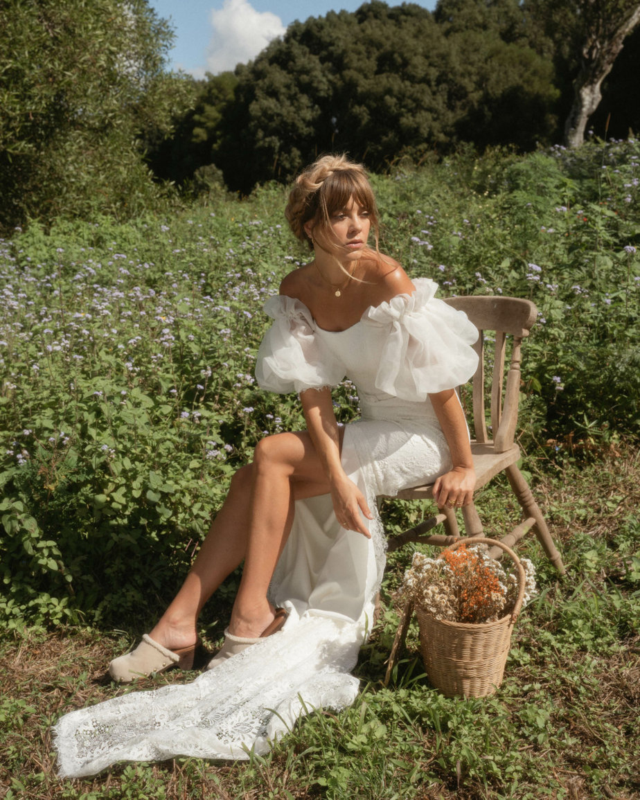 Wynter Karen Willis Holmes from the Wild Hearts Bridal Collection model in garden sunshine chair basket