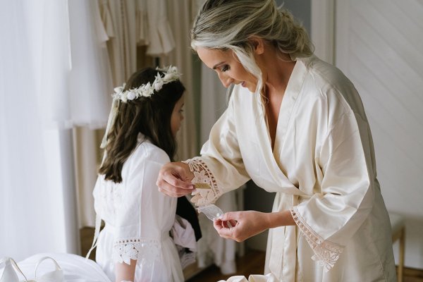 Little girl with floral flower headband getting ready satin nightgown