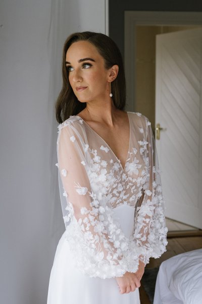 Bride wearing lace dress detail earring