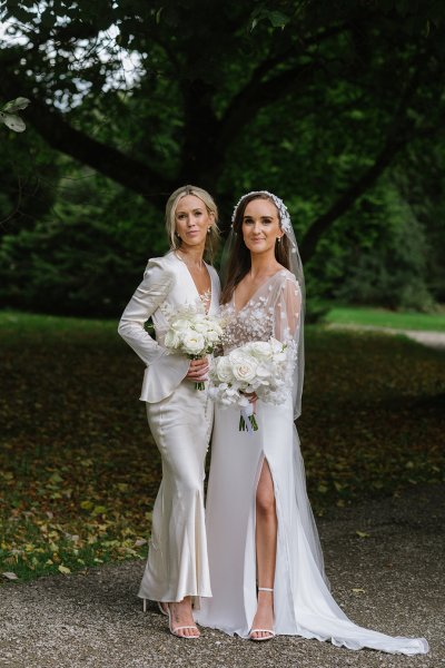 Bride and bridesmaid evening shot white dresses