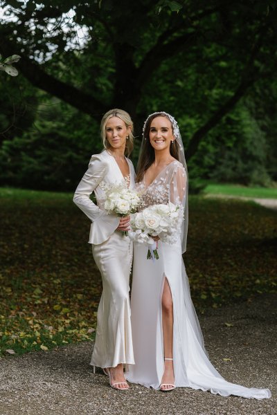 Bride and bridesmaid evening shot white dresses