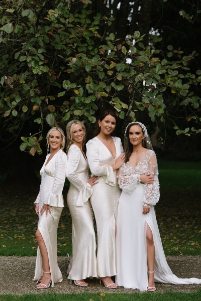 Bridesmaids bride white silky dresses flowers veil