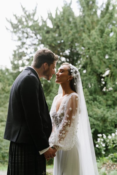 Bride and look in garden looking at each other