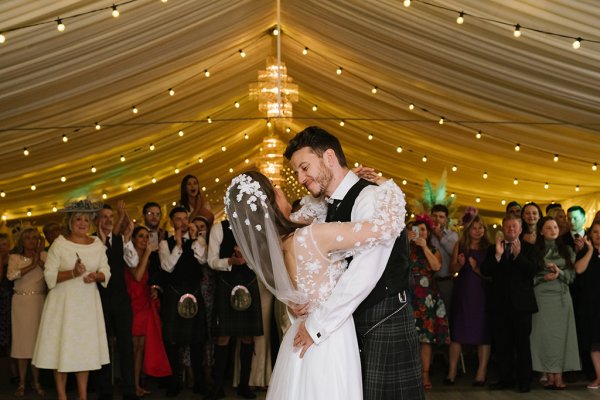 Bride and groom dancefloor kiss kissing embrace