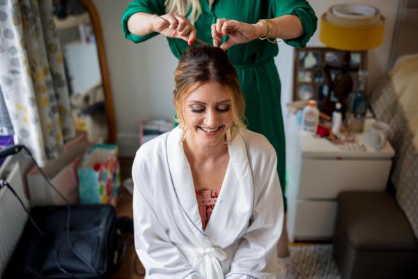 Bride getting hair done hairstylist