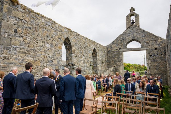 Castle detail and guests waiting for bride