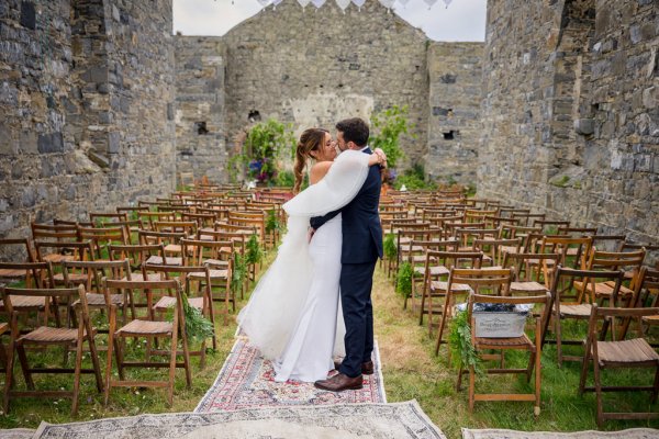 Bride and groom ceremonial room kissing setting