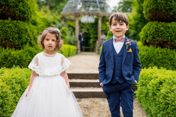 Little boy and girl in garden