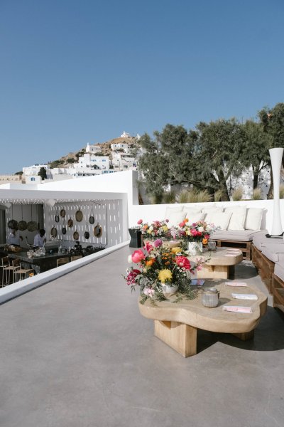 Flowers on table exterior shot trees landscape