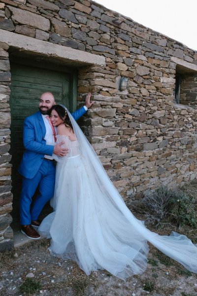 Bricked wall setting with bride and groom