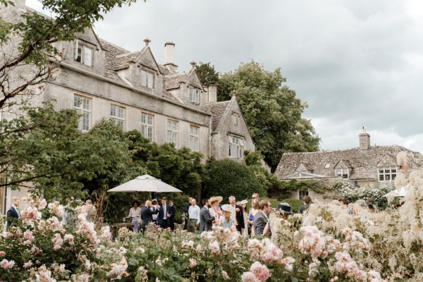 Marquee wedding venue from afar and guests