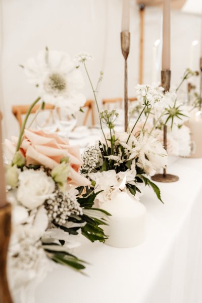 empty dining room roses flowers candles and glasses on table