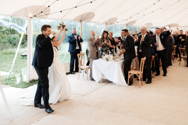 Man and wife bride and groom enter ceremonial room dining room