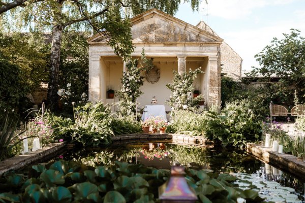 Exterior wedding venue setting flowers