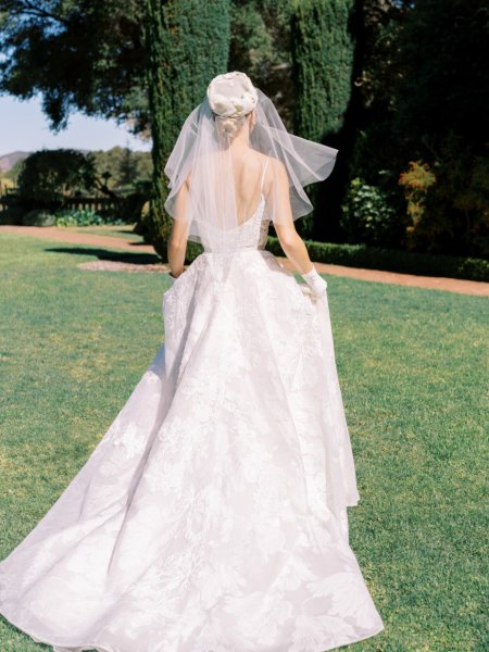 Veil on bride exterior garden shot