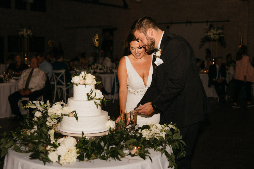 couple cutting wedding cake