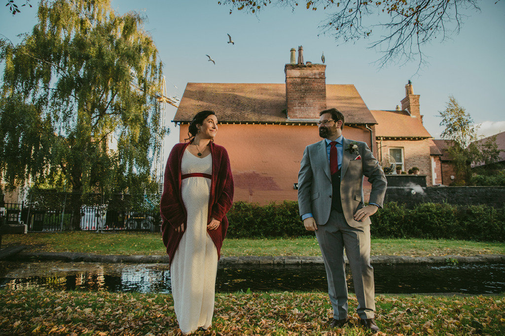 Couple standing in park looking at each other