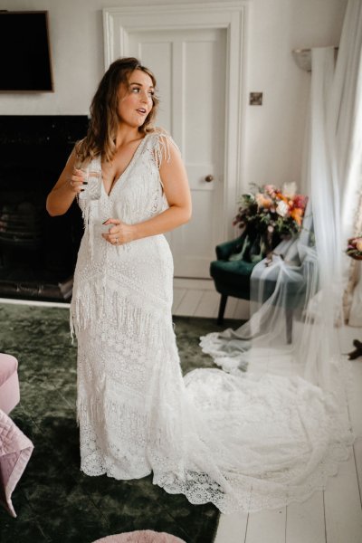 Bride getting ready curtains window dress detail