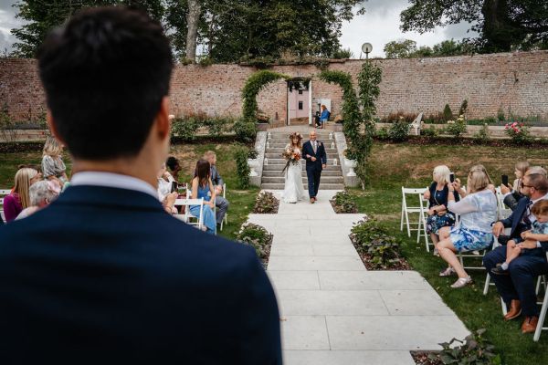 Bride and father walking down the aisle