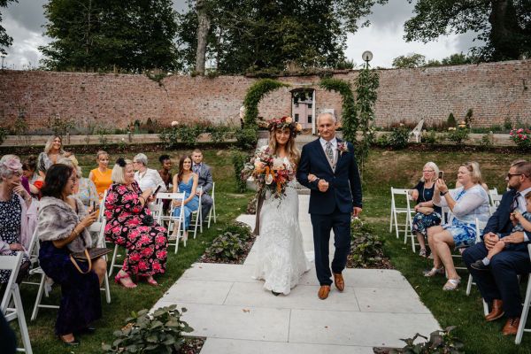 Bride and father walking down the aisle