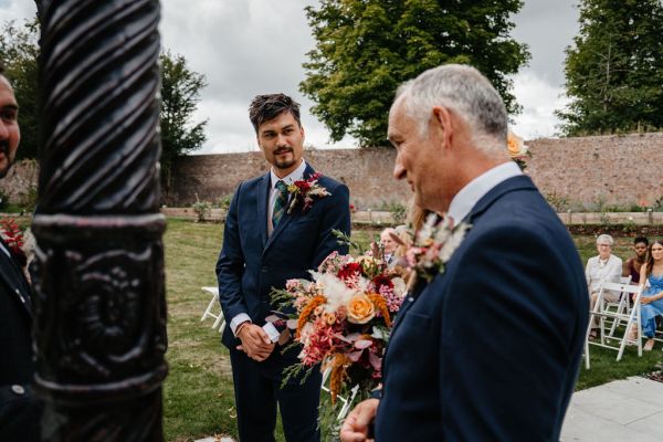 Groom and father and bride at the aisle