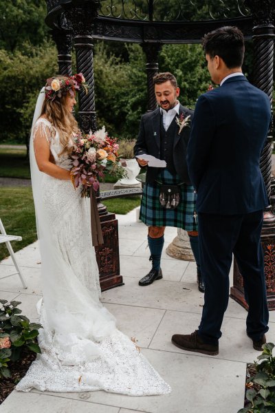 Bride and groom at alter with officiant